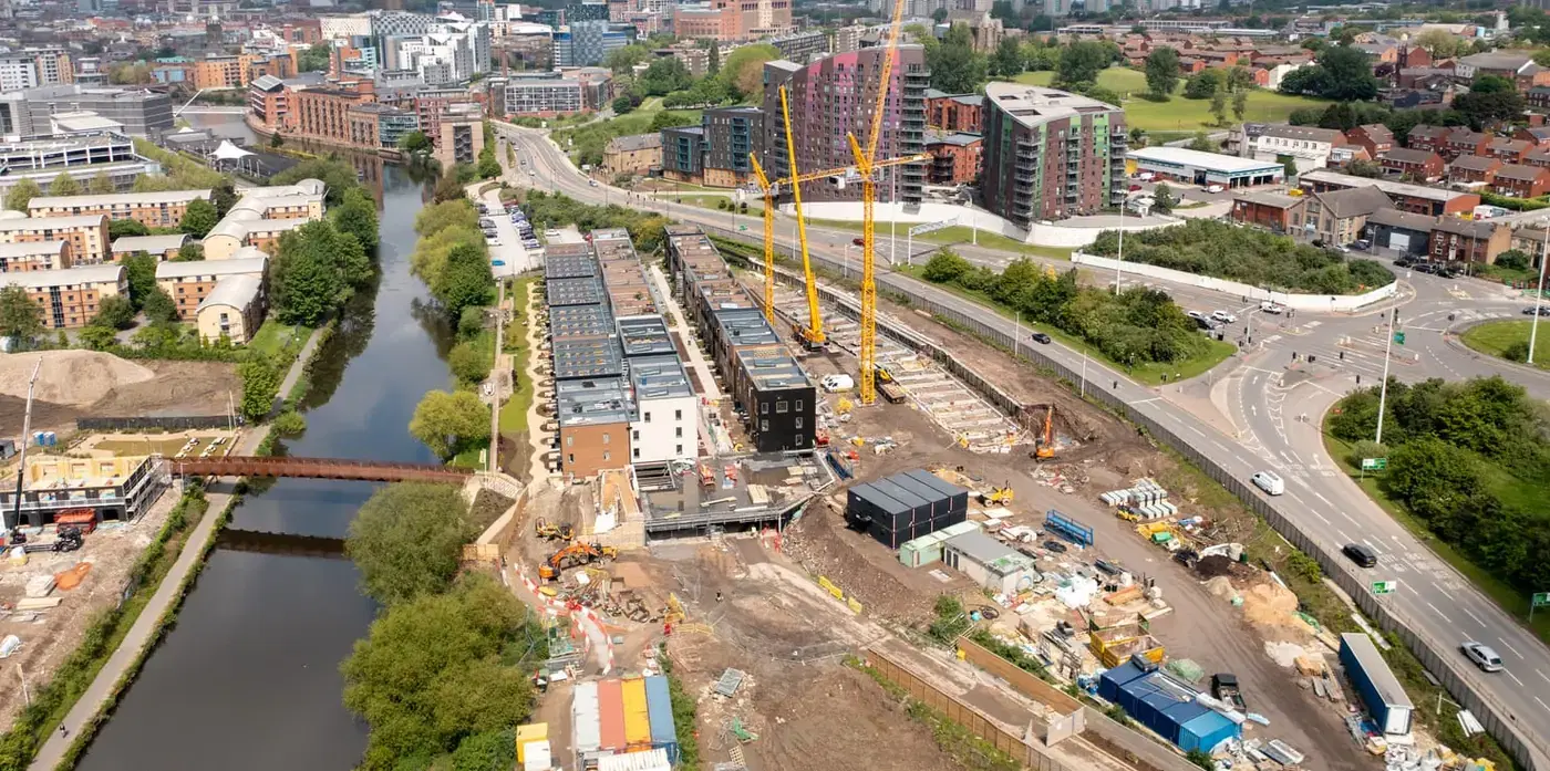 Aerial view of canal-side townhouses and a construction site in Birmingham. Illustrative photograph.
